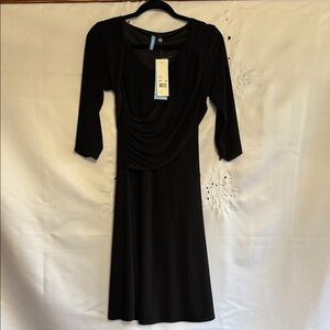 This is a black B-Slim dress with a ruched, criss-cross front.